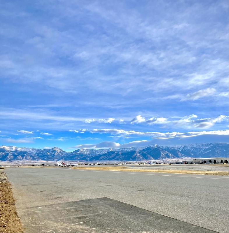 The airfield and mountains beyond the hangar doors