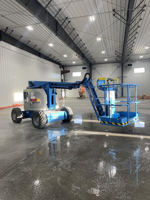 Two lifts staged mid-project inside the hangar