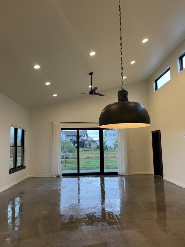 Empty great room with polished concrete floor