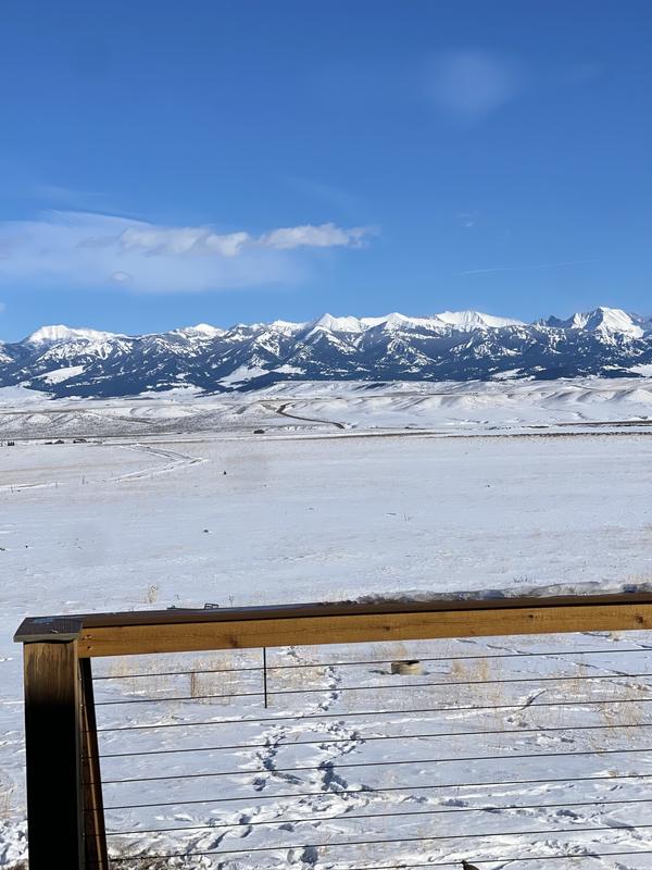 Snow-covered valley and mountains from a client deck